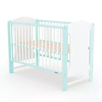 Klassiek babybedje in wit en mint voor peuterslaapkamer