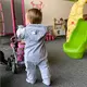 Baby jumpsuit - Roze met capuchon - Rits aan de voorkant
